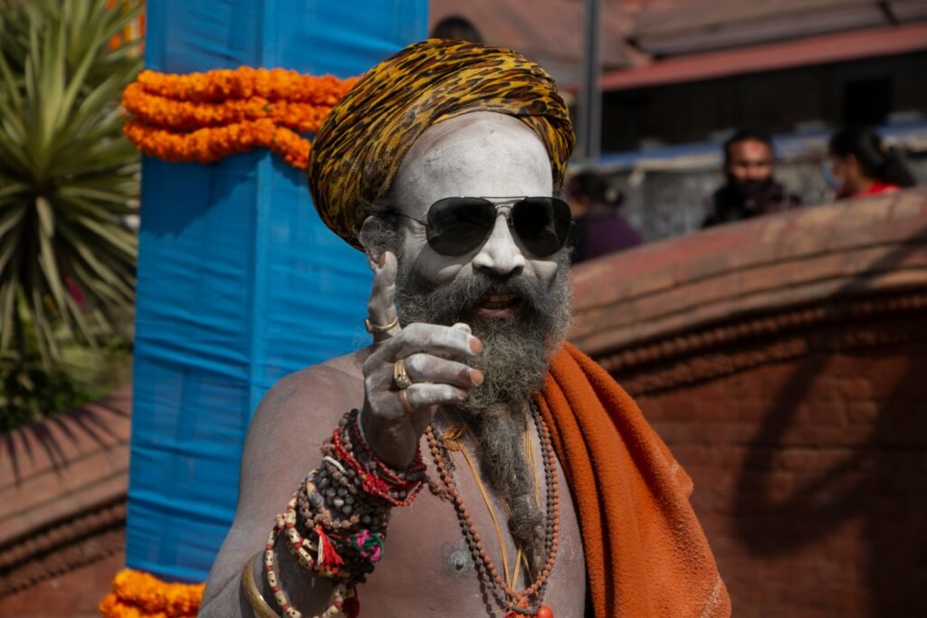 a man with a beard wearing sunglasses and a turban